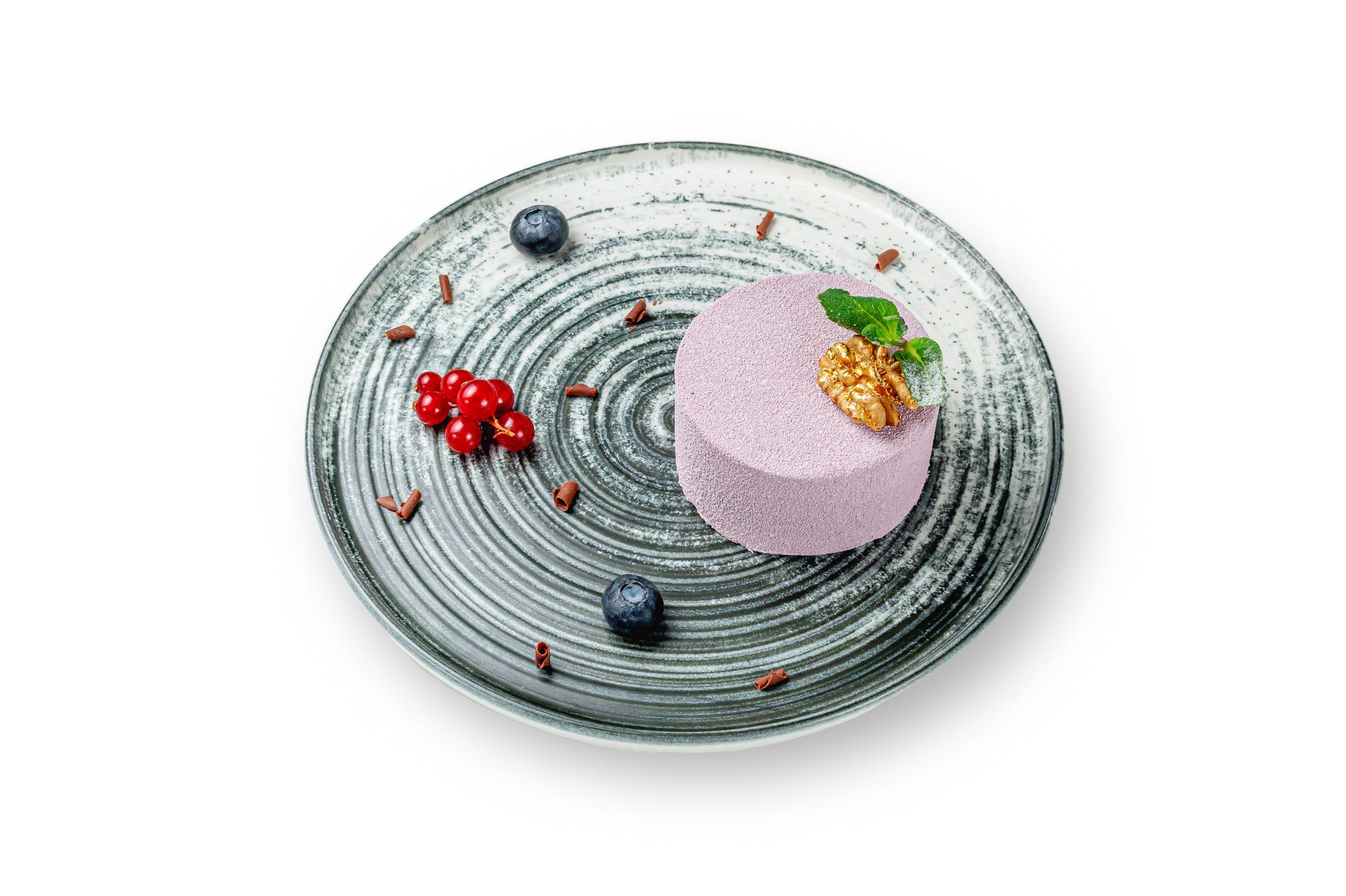 Closeup plated modern dish with neon garnish